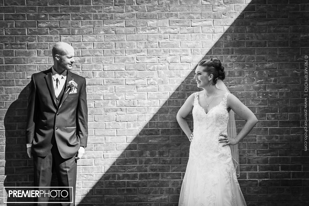 Contrast portrait of bride and groom before wedding ceremony, in black and white